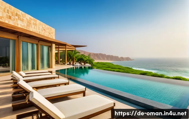 오만의 주요 호텔 및 숙박 시설 - A luxurious beachfront resort in Salalah, Oman, featuring modern architecture blended with natural m...